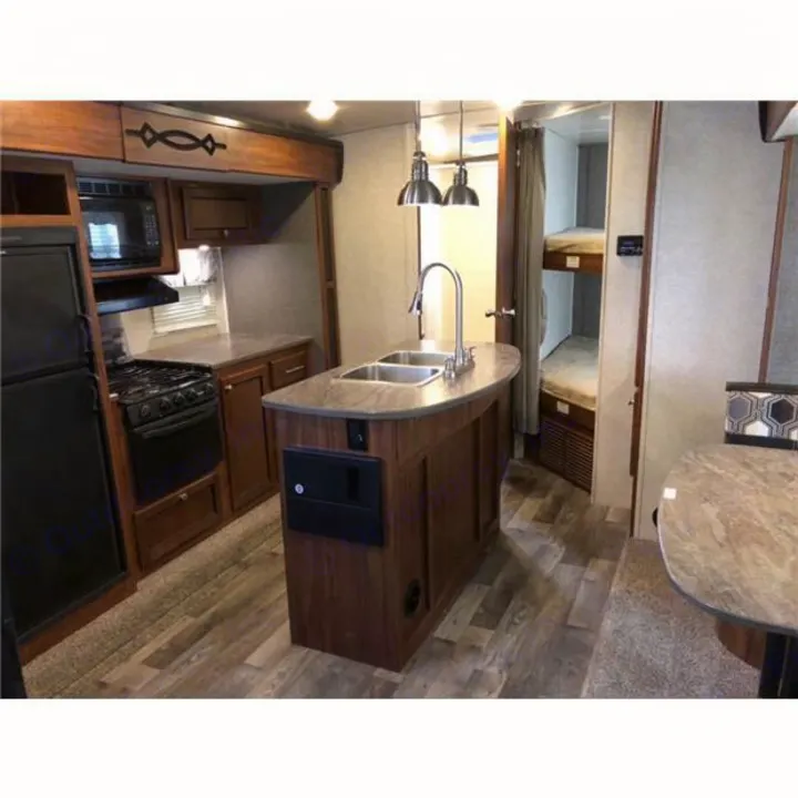 Experience comfort in this RV rental! Features a full kitchen with island, fridge, stove, microwave, and bunk beds.. Heartland Wilderness 2018