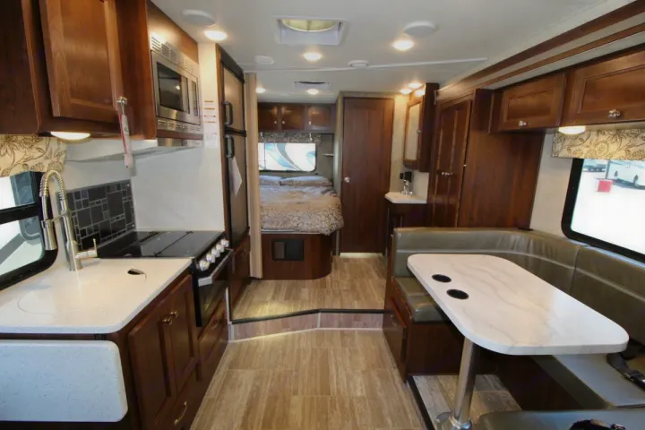 Inside this RV rental, discover a full kitchen, comfortable dinette, and cozy bedroom. Perfect for your next adventure.. Forest River Forester 2018