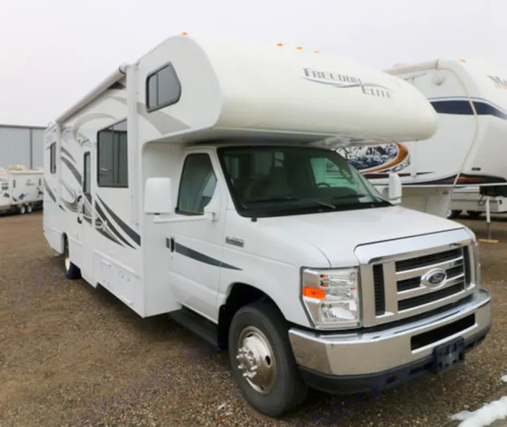 Explore in this white Freedom Elite Class C RV rental. Ford chassis motorhome, ready for your next adventure on the open road.. Thor Motor Coach Freedom Elite 2013
