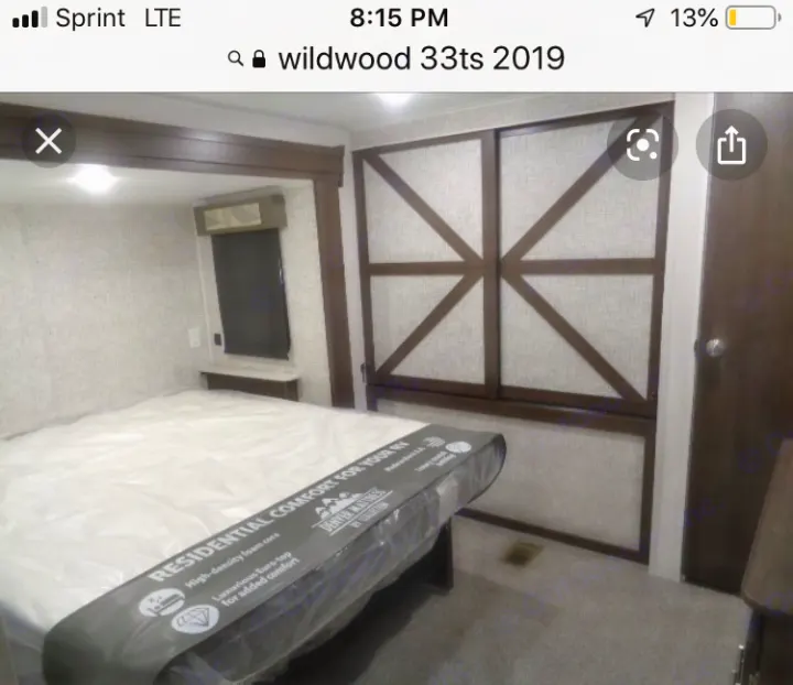 Master bedroom with dual sliding closet doors.. Wildwood 32qbss 33ts 2019