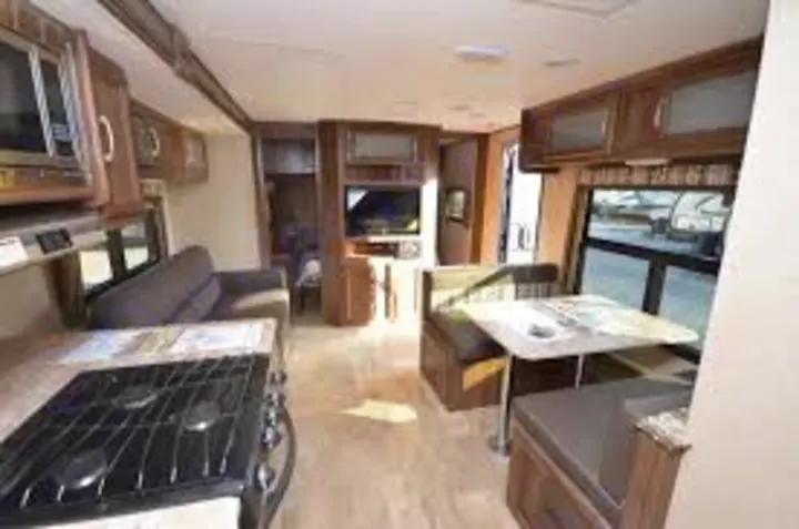Kitchen table makes into a bed. Coachmen Apex 2017