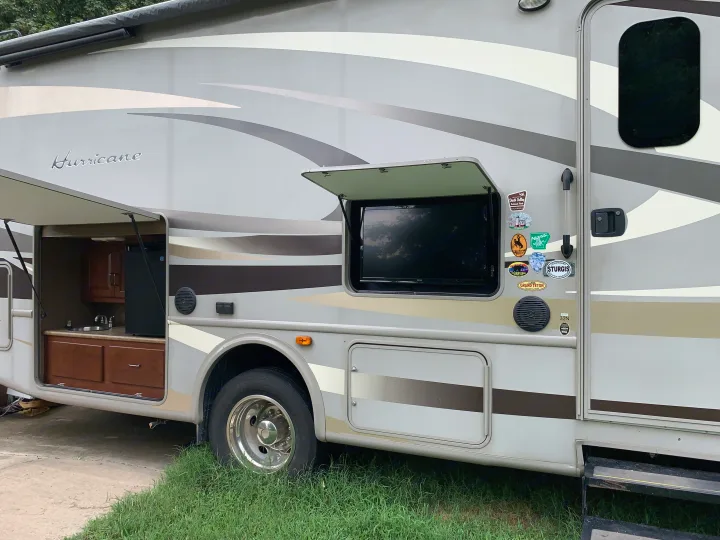This is showings outside tv & kitchen with propane hook up