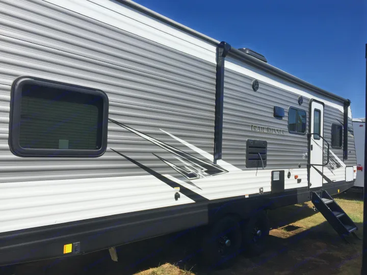 This sleek gray and white travel trailer is ready for adventure! Perfect for your next rv rental and outdoor escapade.. Heartland Trail Runner 2020