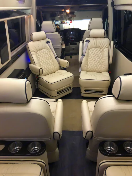 Luxury RV interior: Cream quilted captain's chairs and sleek design offer comfort for your next rv rental adventure.. Other Other 2020