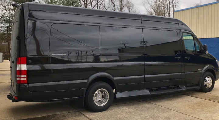 A glossy black Mercedes-Benz Sprinter luxury van, converted for passenger travel, ideal for RV rental.. Other Other 2020