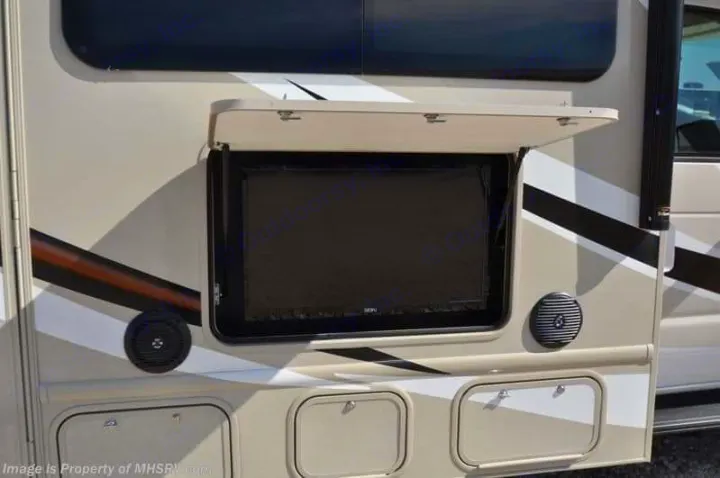 This RV rental features an outdoor TV with speakers & storage compartments for convenient camping entertainment.. Thor Motor Coach Four Winds 2017