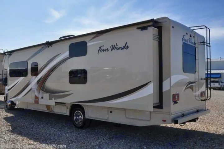 Explore options for your next RV rental! This beige Four Winds motorhome features graphic accents, a slide-out, and a rear ladder.. Thor Motor Coach Four Winds 2017
