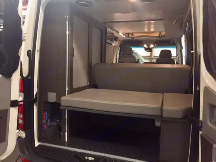 Explore this RV rental's comfortable and modular camper van interior. Features include a convertible bed & storage.. Mercedes Sprinter 2018