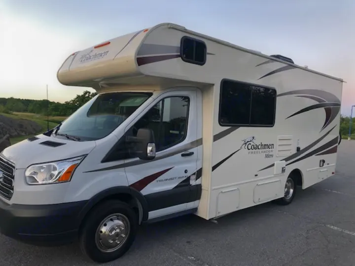 White Coachmen Freelander Micro Class C RV rental motorhome, perfect for road trips and camping adventures.. Ford Freelander 20CB 2018