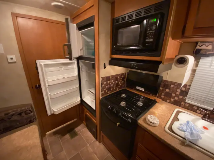 Kitchen/microwave cooktop and fridge. ForestRiver Puma 2011
