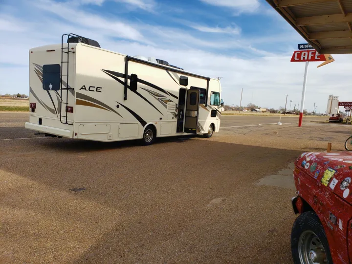 Back view, door open. Thor Motor Coach A.C.E 2020