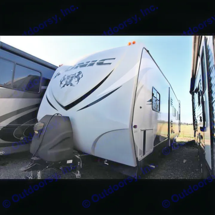Modern white travel trailer RV, perfect for your next rv rental. Parked outdoors with sunny skies.. Eclipse Iconic 2016