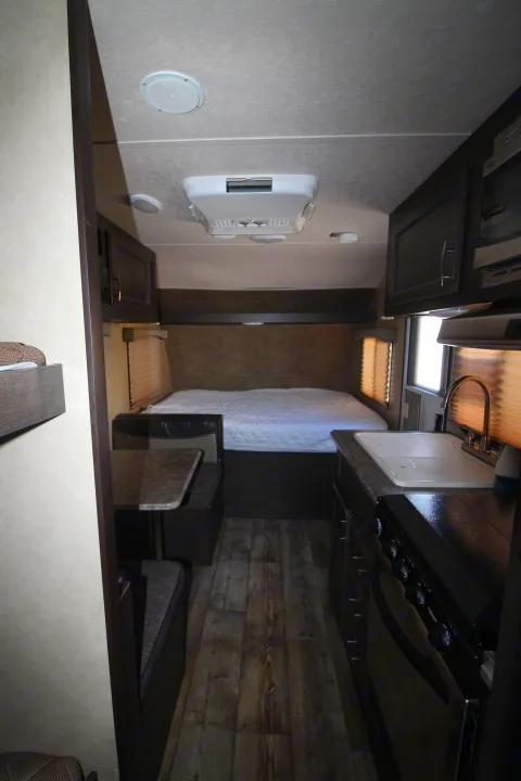 Spacious RV rental interior featuring a comfortable bed, dinette, and full kitchen, ready for your adventure.. Forest River Sonoma 2017