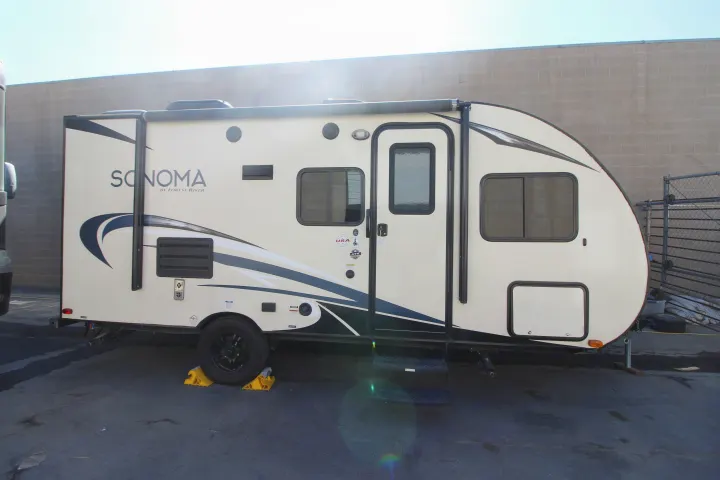 This cream and blue Sonoma by Forest River travel trailer is a perfect rv rental choice.. Forest River Sonoma 2017