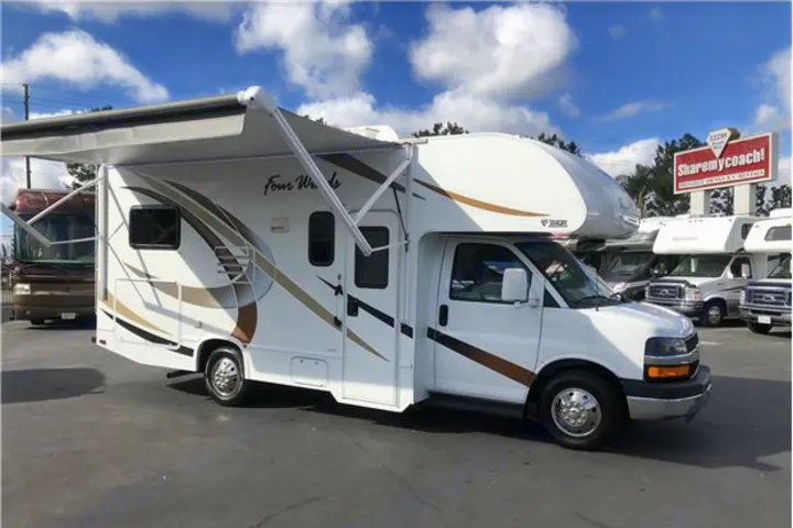 White Thor Four Winds Class C RV with extended awning, ready for your next rv rental adventure.. Thor Motor Coach Four Winds 2017