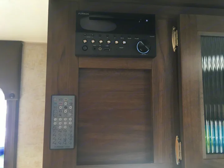 Furrion DV3100 RV entertainment system and remote in an RV rental, ready for camping trips and road trip fun.. Forest River Cherokee Grey Wolf 2018