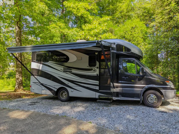 Side view with 13 ft awning. Thor Motor Coach Citation 2013