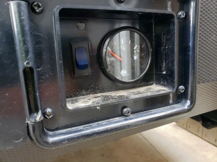 RV rental's dirty control panel: Fuel gauge shows empty, beside a blue fuel system switch.. Forest River XLR hyperlite 2019