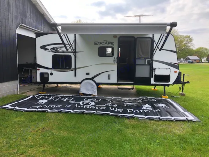 Camper with outdoor rug. K-Z Manufacturing Escape 2016