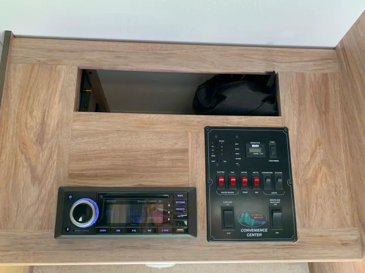 RV rental: Camper's utility control panel (lights, water, power) & Jensen stereo. All set for travel.. Forest River Sunseeker 2019
