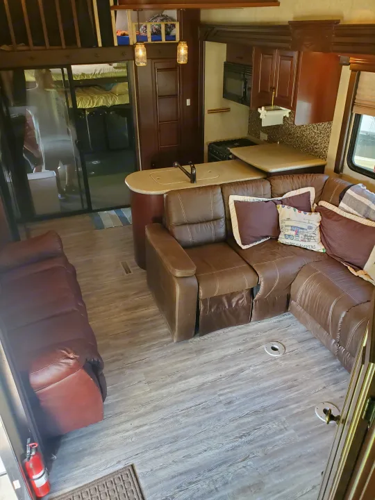 Inside this RV rental: spacious living area, functional kitchen, and multiple bunk/sleeper areas for ultimate comfort.. Heartland Cyclone 2014