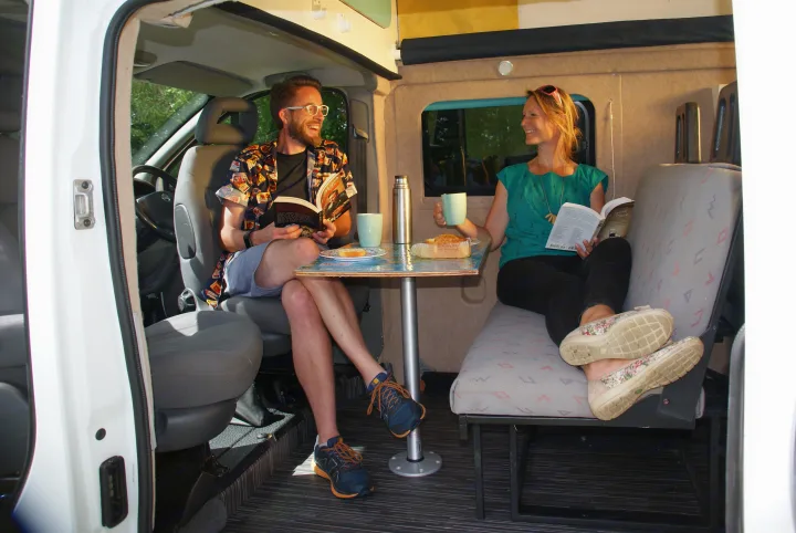 Comfy, sociable sitting and dining for 4. Milly has 4 belted travel seats and is a 4 berth campervan - ideal for a family of 4. Nissan Primastar 2009