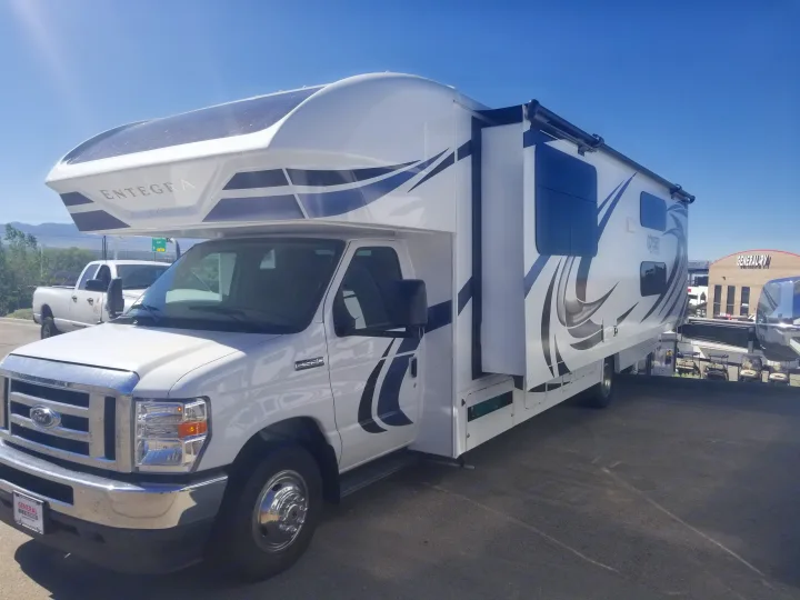 This white Entegra Odyssey Class C recreation vehicle (RV) rental has an extended slide-out for more space.. Entegra Coach Other 2021