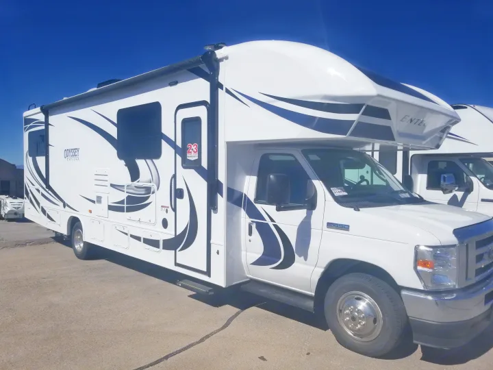 White Class C RV for rent, featuring black decals and a Ford E-450 chassis, parked outdoors on asphalt.. Entegra Coach Other 2021