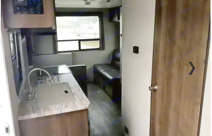 Compact RV rental interior featuring a kitchenette, dinette, and cozy living space, perfect for travel adventures.. Shasta Oasis 2019