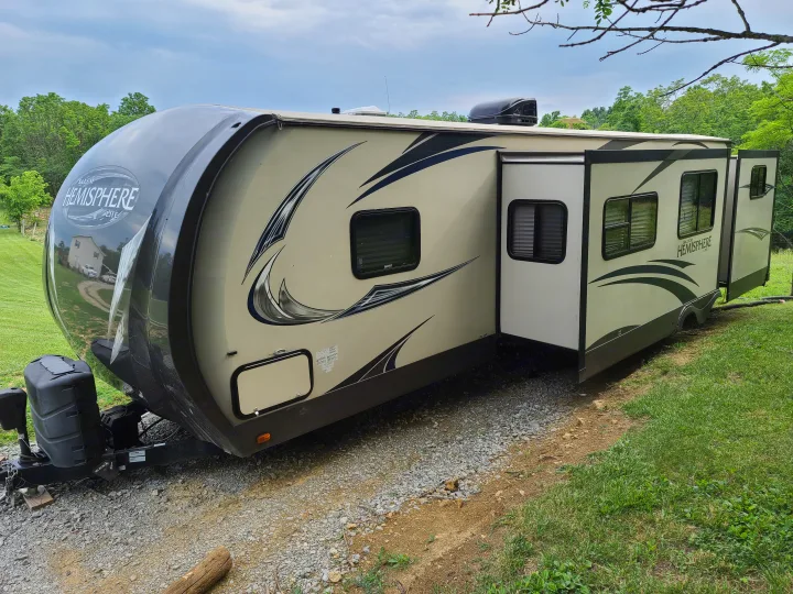 Spacious Salem Hemisphere Lite travel trailer, ready for your rv rental getaway. Two slide-outs visible.. Forest River Salem Hemisphere 2015