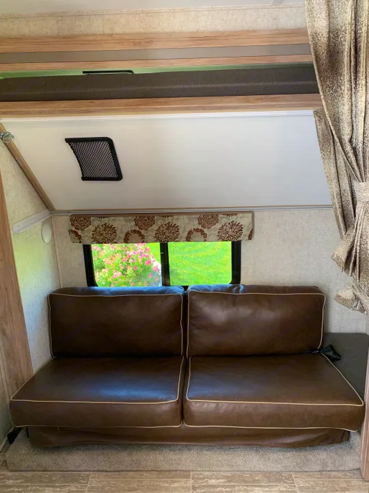 Bunks with top tilted up for driving. Bottom converts to a bed as well.. Forest River Forester 2020