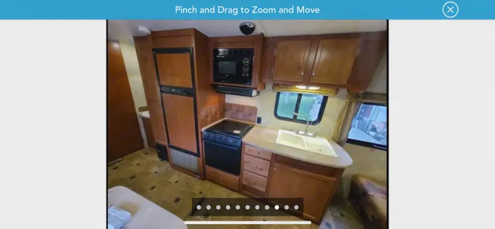 Spacious RV rental kitchen with microwave, fridge, stove, sink, and ample counter space for your next adventure.. Northwood Mfg Nash 2014