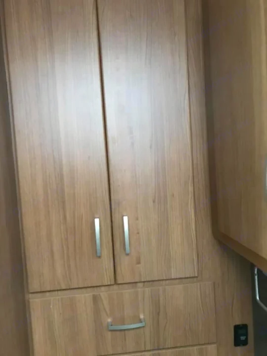 Inside an rv rental: light wooden cabinets & drawers with metal handles. Essential storage for your road trip.. Winnebago Trend 2017