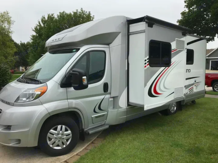 A silver Winnebago RV, a spacious motorhome with an extended side slide-out. Ideal for your next rv rental adventure.. Winnebago Trend 2017