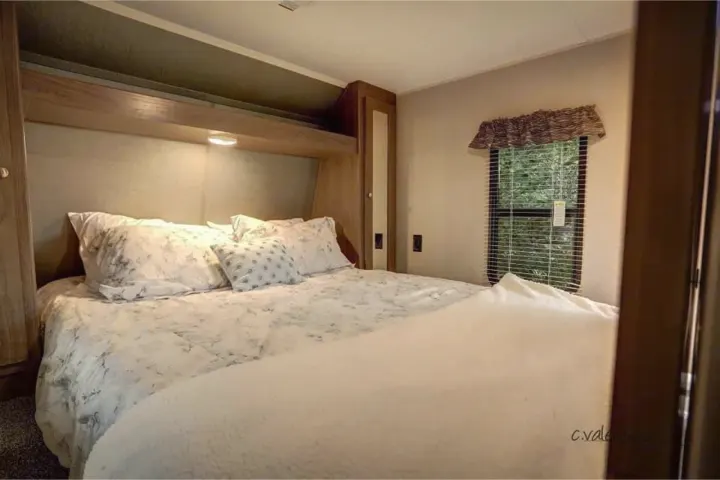 Comfortable and cozy queen bed. Rest well after a day of camping fun.. Keystone Other 2018