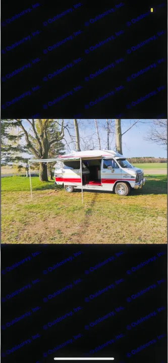 Experience adventure in this vintage RV rental! Classic camper van with awning extended in a sunny field. Perfect for road trips.. Chevrolet G20 1983