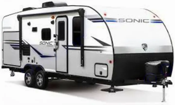 A modern white and grey Sonic travel trailer, ideal for an RV rental camping adventure. Towable RV with two axles.. sonic Venture 2017