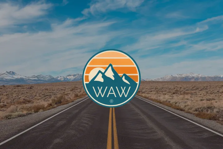 Open road through a desert landscape leading to snowy mountains. Ideal for your next RV rental adventure. Features a "WAW" logo.. Airstream Bambi 2021