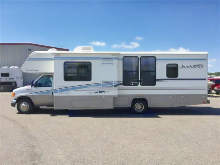 This white and gray Fleetwood Jamboree Class C RV rental, featuring an extended slide-out, is ready for your next adventure.. Fleetwood Jamboree 2005