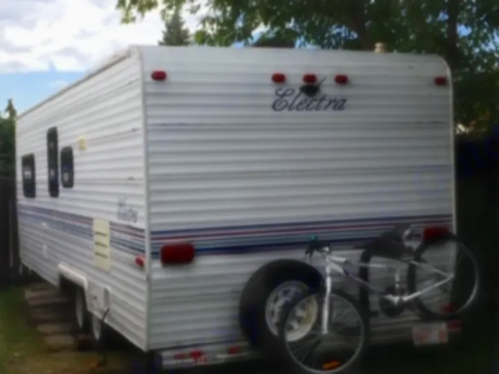 This white Electra travel trailer, equipped with a bike rack, is ready for your next RV rental adventure.. Electra Electra 1996