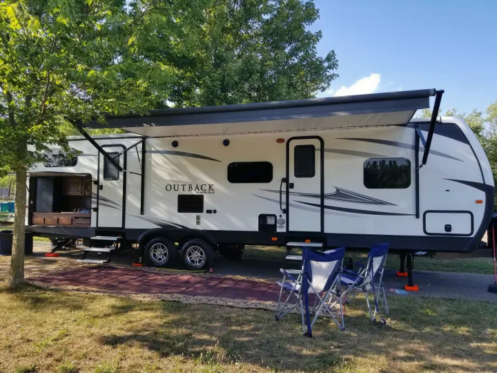 Full set up... including 18ft awning, outdoor rug, 2 trash cans & chairs... the super convenient out door kitchen with fridge, sink & 2 burner stove . Keystone Outback 2017