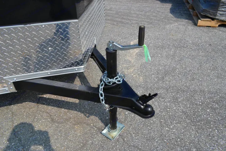 Trailer hitch & jack setup, ideal for an RV rental. Features diamond plate and safety chain. Ready to tow.. LOOK Enclosed  Trailer 2019