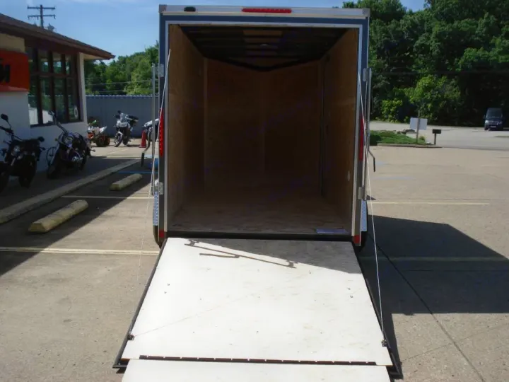 Empty enclosed trailer, ramp down. Perfect for RV rental users hauling bikes or gear on trips.. LOOK Enclosed  Trailer 2019