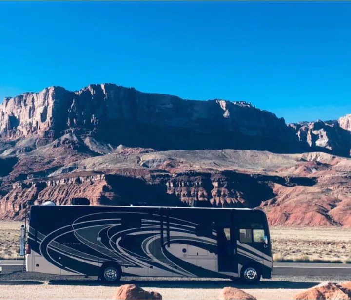 Modern RV rental parked roadside.. Thor Motor Coach Challenger 2018