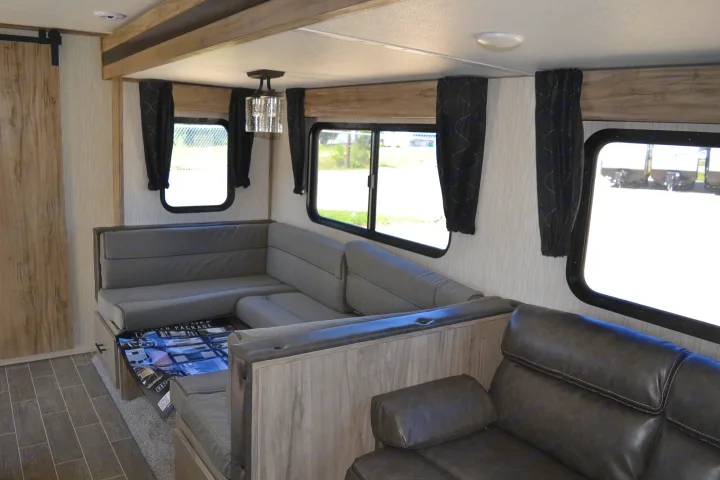 This RV rental offers a comfortable living space with a wraparound dinette, reclining sofa, and bright windows.. Forest River Other 2020