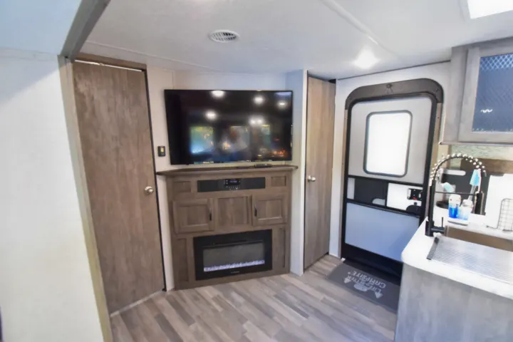 50 inch TV with electric fireplace below. Forest River Vibe 2020