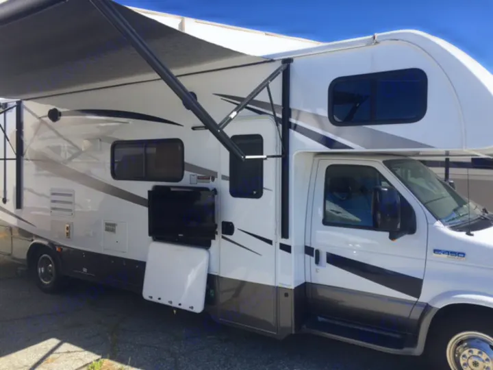 White and grey Class C RV rental with an extended awning and outdoor TV, ready for your next adventure.. Forest River Forester 2016