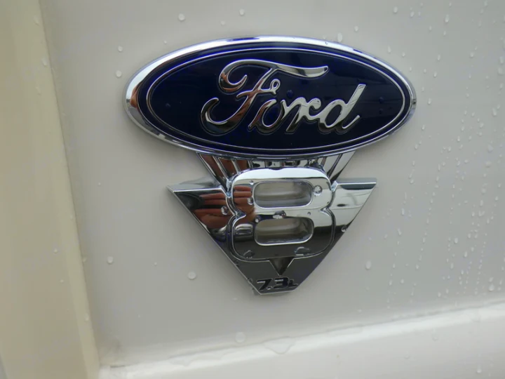 Wet Ford V8 7.3L badge on an RV rental, highlighting power and reliability for your journey.. Holiday Rambler Admiral 2021