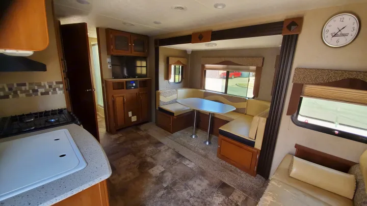 Spacious RV rental interior featuring a full kitchen, comfortable dinette, and living area, perfect for your next adventure.. Coachmen Freedom Express 2015