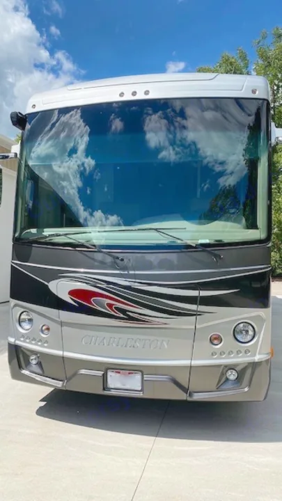 Front view of a Charleston motorhome parked outside. This sleek RV rental is ready for adventure!. Charleston Charleston Motorhome 2015